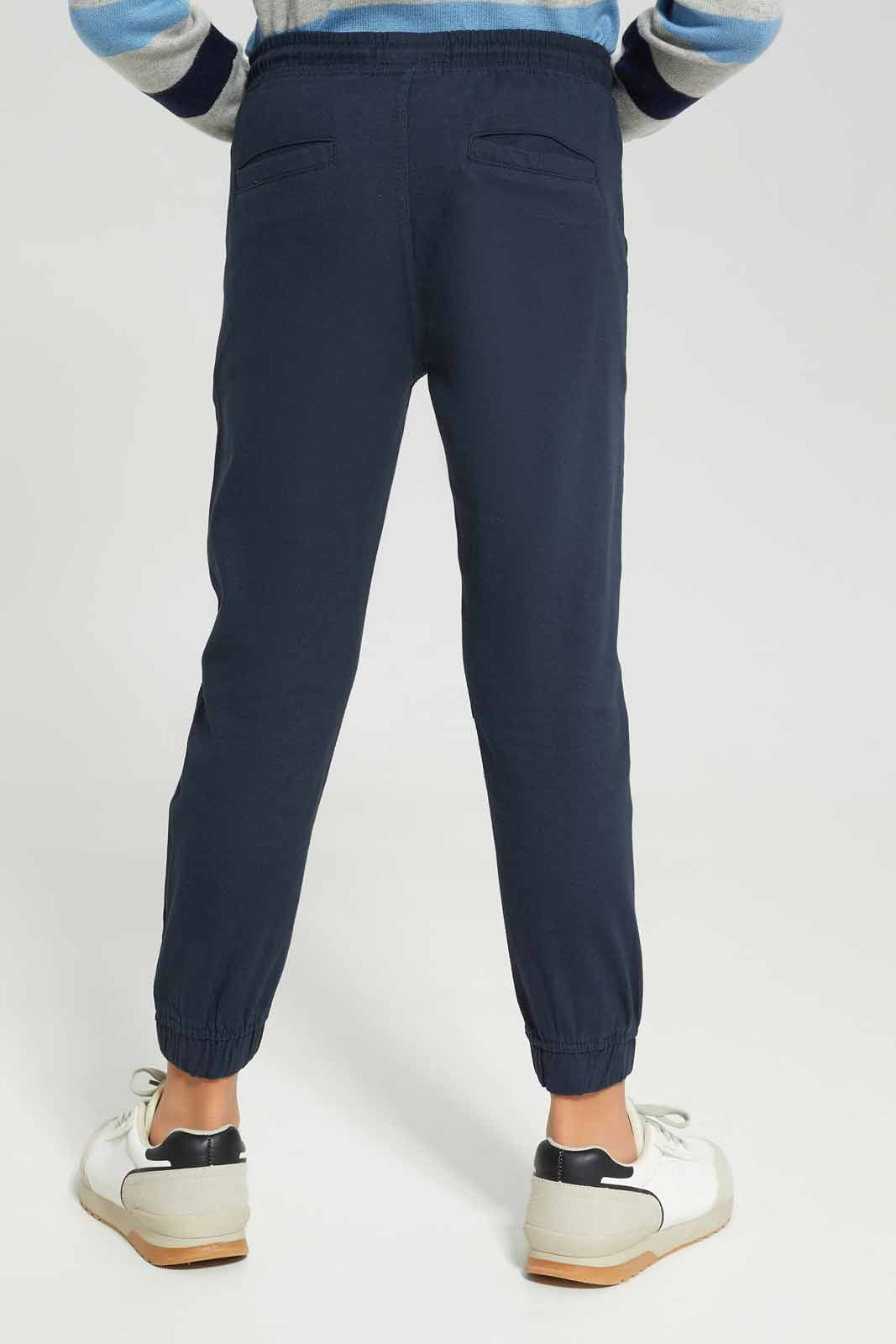 Redtag-Boys-Navy-Elasticated-Waist-Jogger-BOY-Trousers,-Category:Trousers,-Colour:Navy,-Deals:New-In,-Dept:Boys,-Filter:Boys-(2-to-8-Yrs),-New-In-BOY-APL,-Non-Sale,-S23A,-Section:Boys-(0-to-14Yrs),-VLM-Boys-2 to 8 Years
