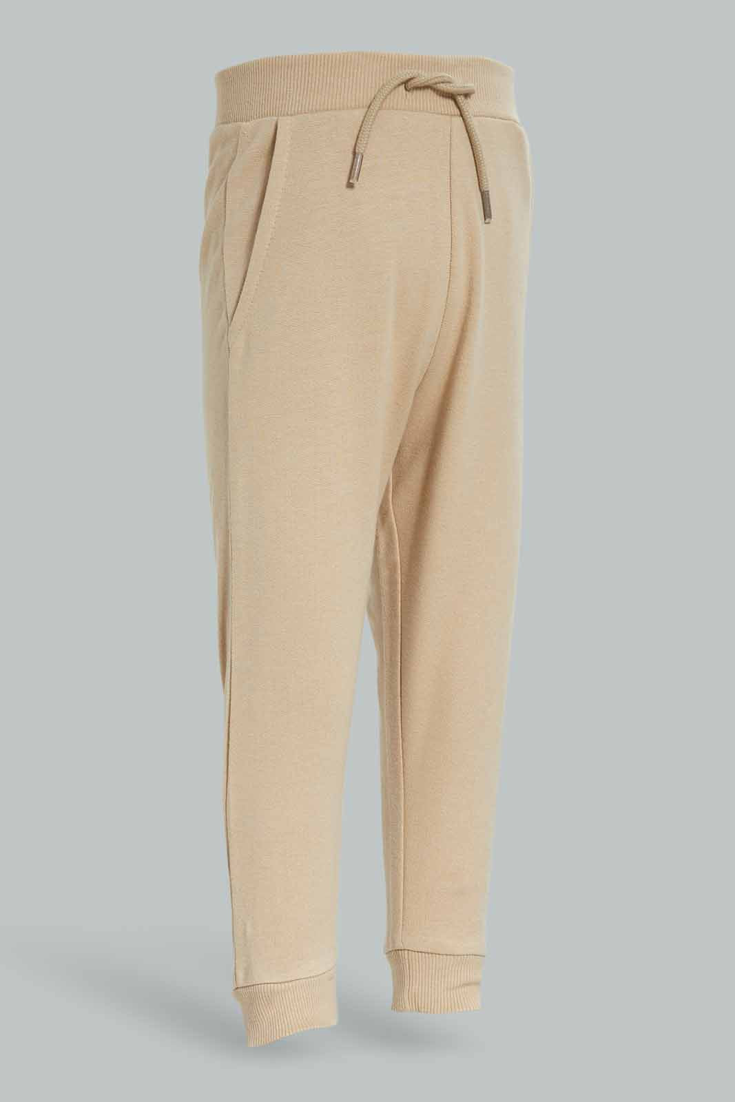 Redtag-Boys-Stone-Plain-Knit-Joggers-Category:Joggers,-Colour:Beige,-Deals:New-In,-Dept:Boys,-Filter:Infant-Boys-(3-to-24-Mths),-INB-Joggers,-New-In-INB-APL,-Non-Sale,-S23A,-Section:Boys-(0-to-14Yrs)-Infant-Boys-3 to 24 Months