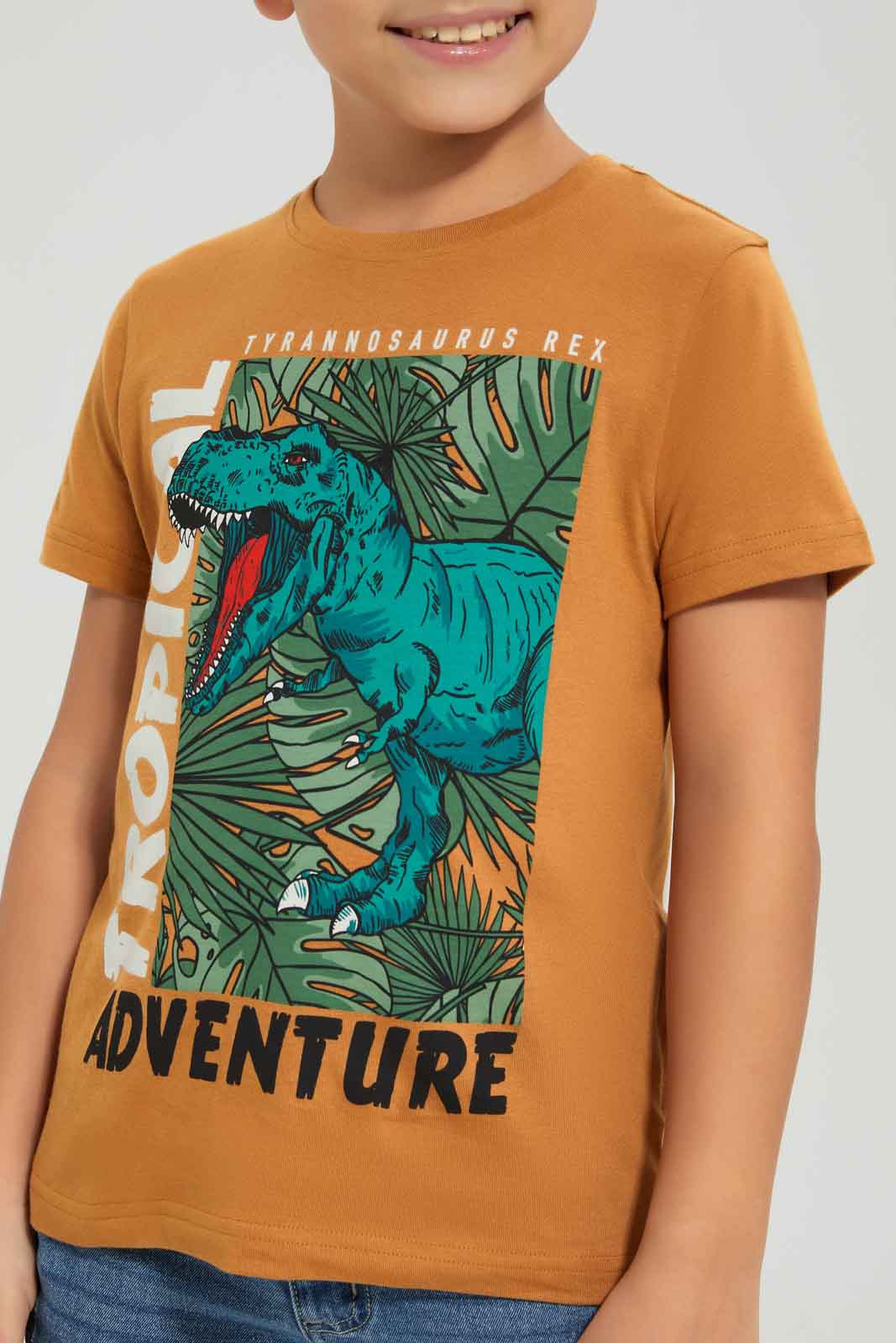 Redtag-Boys-Brown-Dino-Short-Sleeve-Graphic-T-Shirt-BOY-T-Shirts,-Category:T-Shirts,-Colour:Brown,-Deals:New-In,-Dept:Boys,-Filter:Boys-(2-to-8-Yrs),-New-In-BOY-APL,-Non-Sale,-S23A,-Section:Boys-(0-to-14Yrs),-TBL-Boys-2 to 8 Years