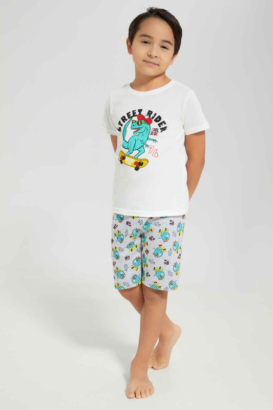 Redtag-Boys-White-Dino-Short-Sleeve-Graphic-Tee-And-Aop-Shorts-Pyjama-Set-BOY-Pyjama-Sets,-Category:Pyjama-Sets,-Colour:White,-Deals:New-In,-Dept:Boys,-Filter:Boys-(2-to-8-Yrs),-New-In-BOY-APL,-Non-Sale,-S23A,-Section:Boys-(0-to-14Yrs),-VLM-Boys-2 to 8 Years