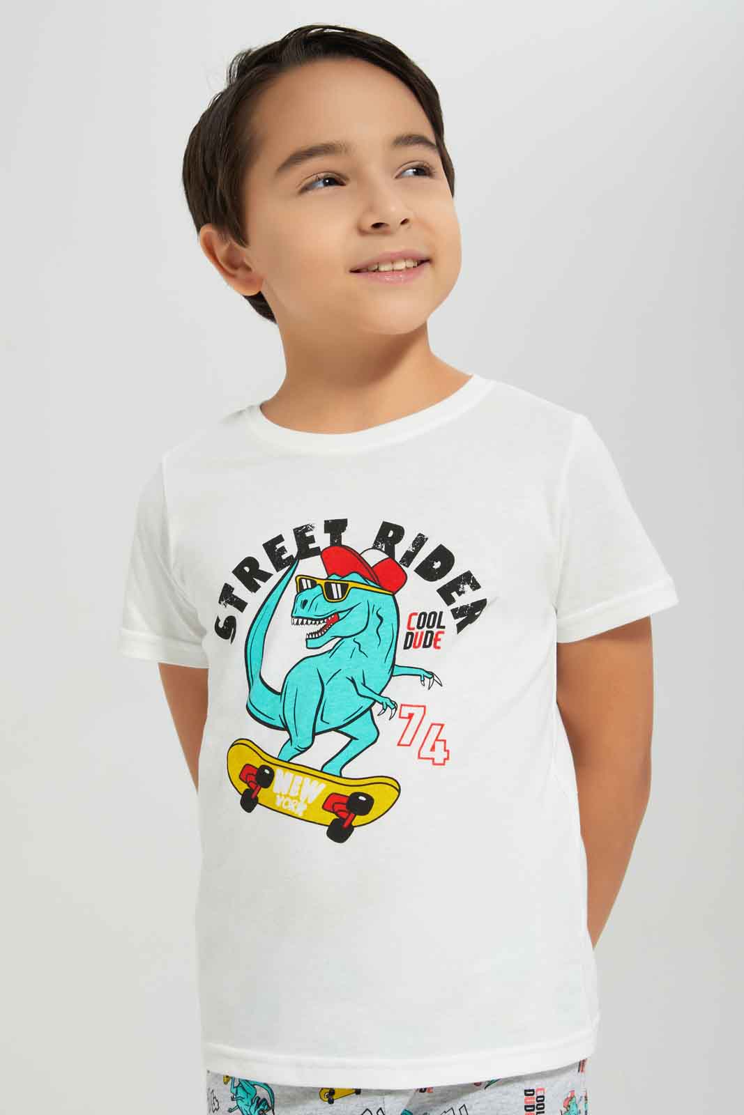 Redtag-Boys-White-Dino-Short-Sleeve-Graphic-Tee-And-Aop-Shorts-Pyjama-Set-BOY-Pyjama-Sets,-Category:Pyjama-Sets,-Colour:White,-Deals:New-In,-Dept:Boys,-Filter:Boys-(2-to-8-Yrs),-New-In-BOY-APL,-Non-Sale,-S23A,-Section:Boys-(0-to-14Yrs),-VLM-Boys-2 to 8 Years