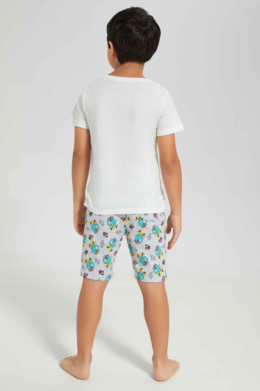 Redtag-Boys-White-Dino-Short-Sleeve-Graphic-Tee-And-Aop-Shorts-Pyjama-Set-BOY-Pyjama-Sets,-Category:Pyjama-Sets,-Colour:White,-Deals:New-In,-Dept:Boys,-Filter:Boys-(2-to-8-Yrs),-New-In-BOY-APL,-Non-Sale,-S23A,-Section:Boys-(0-to-14Yrs),-VLM-Boys-2 to 8 Years