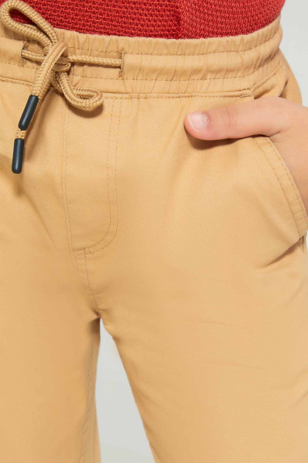 Redtag-Boys-Beige-Elasticated-Waist-Jogger-BOY-Trousers,-Category:Trousers,-Colour:Beige,-Deals:New-In,-Dept:Boys,-Filter:Boys-(2-to-8-Yrs),-New-In-BOY-APL,-Non-Sale,-S23A,-Section:Boys-(0-to-14Yrs),-VLM-Boys-2 to 8 Years