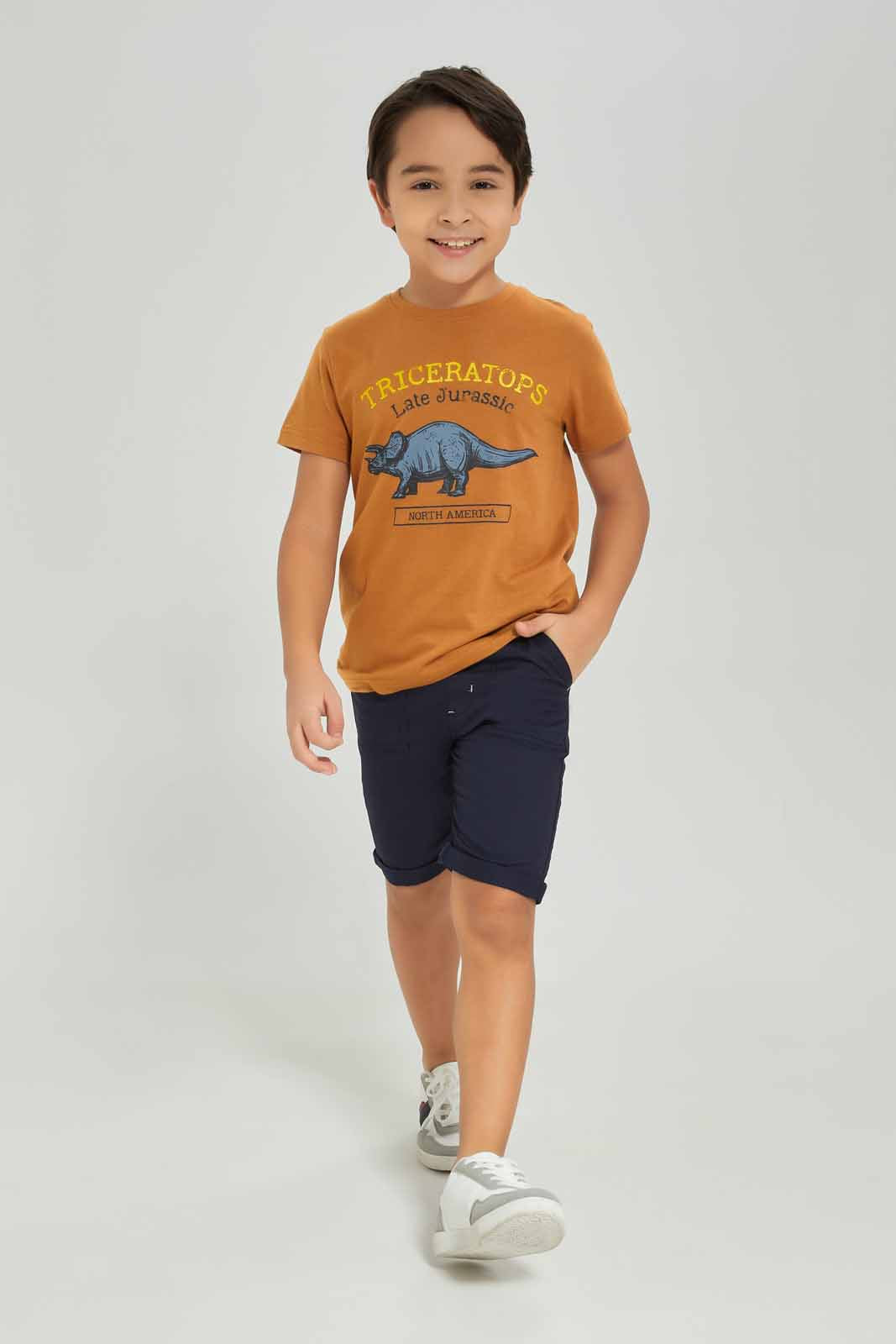 Redtag-Boys-Brown-Dino-Graphic-Short-Sleeve-T-Shirt-BOY-T-Shirts,-Category:T-Shirts,-Colour:Brown,-Deals:New-In,-Dept:Boys,-Filter:Boys-(2-to-8-Yrs),-New-In-BOY-APL,-Non-Sale,-S23A,-Section:Boys-(0-to-14Yrs),-TBL-Boys-2 to 8 Years