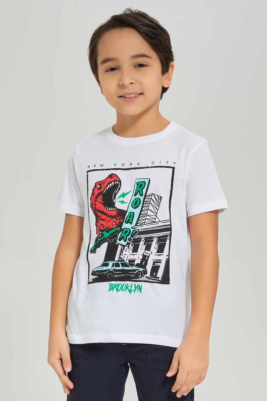 Redtag-Boys-White-Dino-Short-Sleeve-Graphic-T-Shirt-BOY-T-Shirts,-Category:T-Shirts,-Colour:White,-Deals:New-In,-Dept:Boys,-Filter:Boys-(2-to-8-Yrs),-New-In-BOY-APL,-Non-Sale,-S23A,-Section:Boys-(0-to-14Yrs),-TBL-Boys-2 to 8 Years