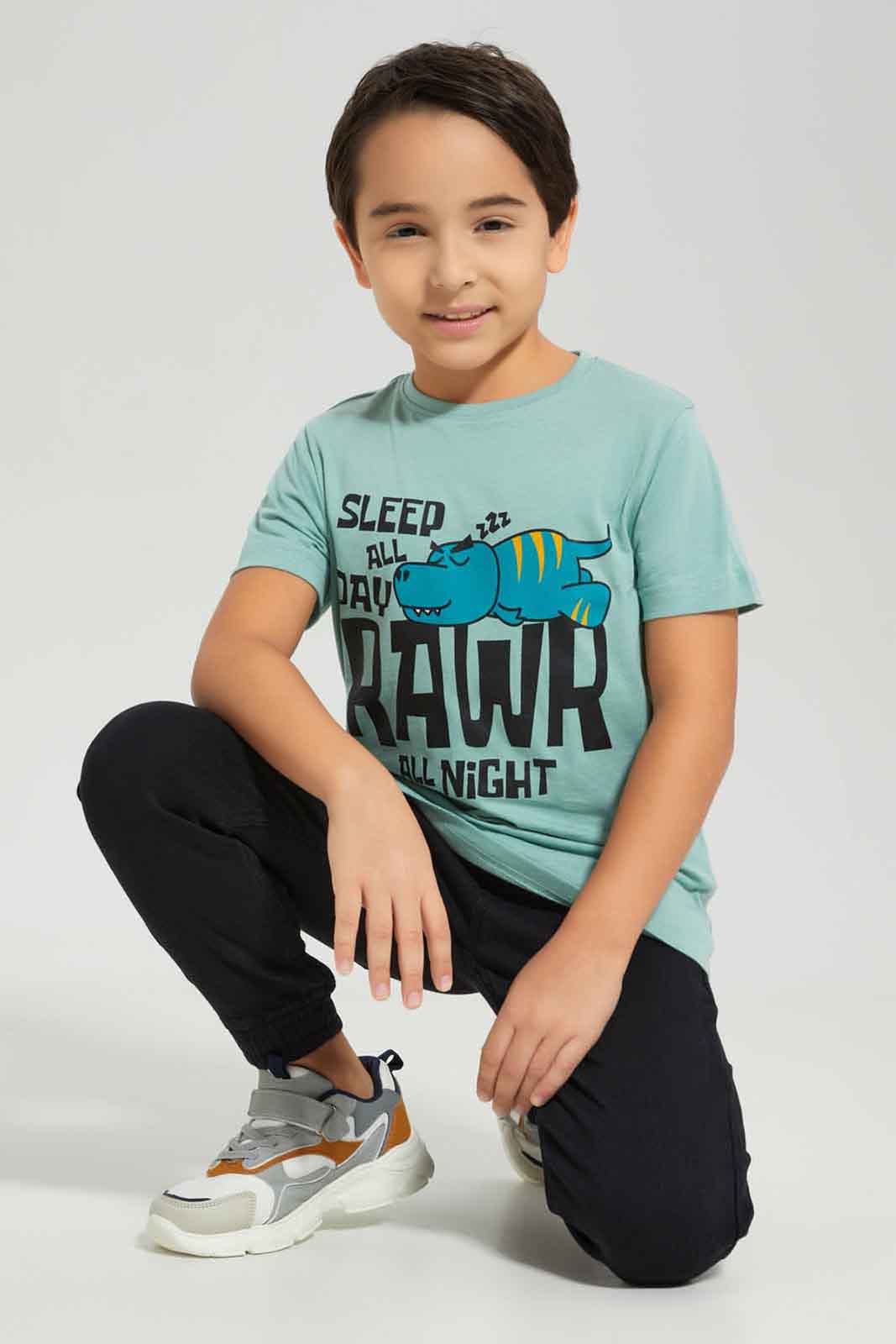 Redtag-Boys-Olive-Dino-Short-Sleeve-Graphic-T-Shirt-BOY-T-Shirts,-Category:T-Shirts,-Colour:Olive,-Deals:New-In,-Dept:Boys,-Filter:Boys-(2-to-8-Yrs),-New-In-BOY-APL,-Non-Sale,-S23A,-Section:Boys-(0-to-14Yrs),-TBL-Boys-2 to 8 Years