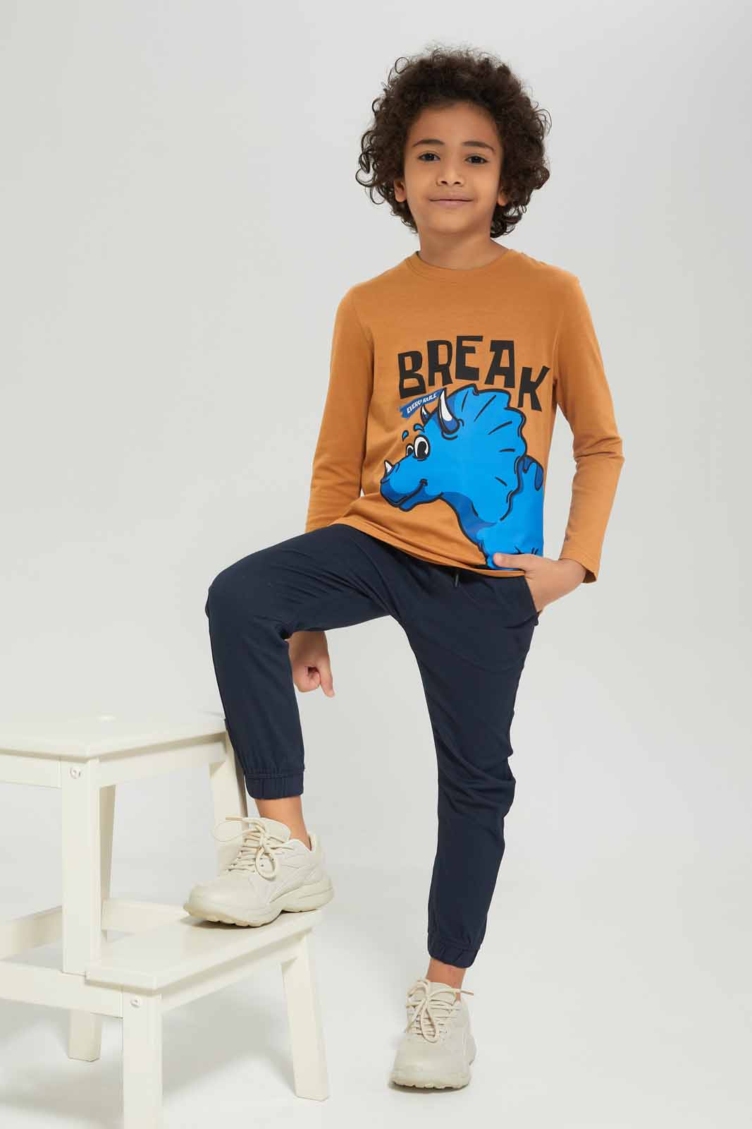 Redtag-Boys-Brown-Dino-Long-Sleeve-Graphic-T-Shirt-BOY-T-Shirts,-Category:T-Shirts,-Colour:Brown,-Deals:New-In,-Dept:Boys,-Filter:Boys-(2-to-8-Yrs),-New-In-BOY-APL,-Non-Sale,-S23A,-Section:Boys-(0-to-14Yrs),-TBL-Boys-2 to 8 Years